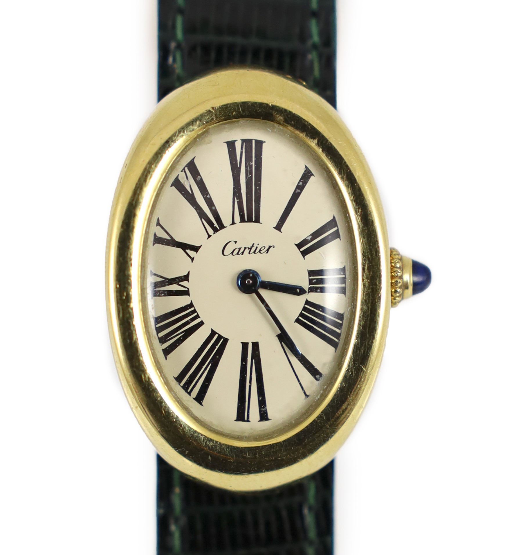 A lady's 18ct gold Cartier Baignoire manual wind oval wrist watch, on a Cartier green leather strap with deployment clasp